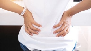 What is radiculopathy (pinched nerve) and how is it treated?